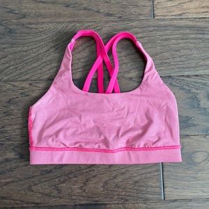Bright pink Lulu Lemon sports bra